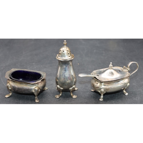 240 - A 3-piece Chester silver cruet with scallop shaped rims on splayed feet comprising mustard with blue... 