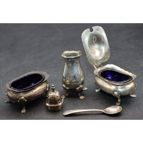 240 - A 3-piece Chester silver cruet with scallop shaped rims on splayed feet comprising mustard with blue... 