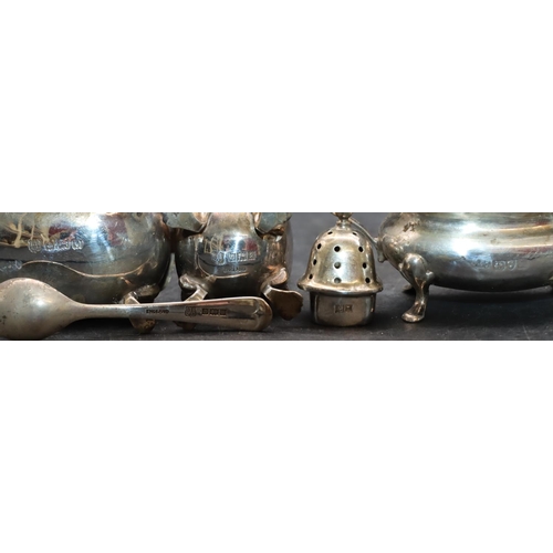 240 - A 3-piece Chester silver cruet with scallop shaped rims on splayed feet comprising mustard with blue... 