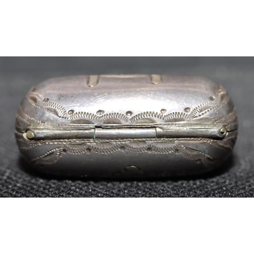 247 - A Victorian silver novelty vinaigrette in the form of a handbag with chain, hinged front enclosing p... 