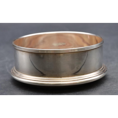 250 - A modern Mappin & Webb, London silver wine coaster with wooden centre, 15cm diameter