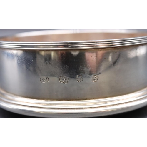 250 - A modern Mappin & Webb, London silver wine coaster with wooden centre, 15cm diameter