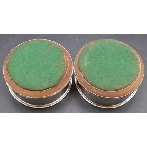 251 - A pair of modern London silver wine coasters with wooden centres, 10cm diameter