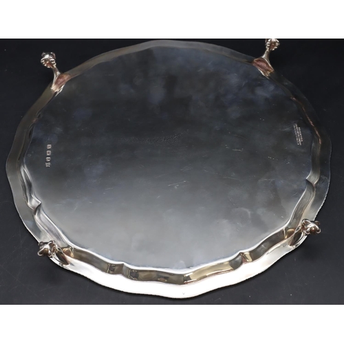 254 - A George VI silver pie crust salver with gadroon rim on 4 splayed claw and ball feet, London 1964, m... 