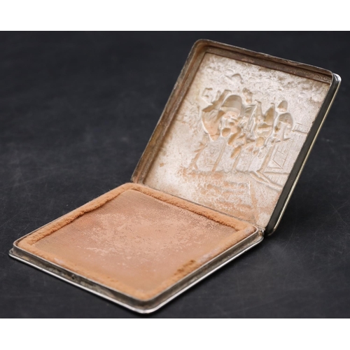 263 - A Continental silver coloured metal square compact, stamped ZPLA, with embossed hinged lid with vari... 