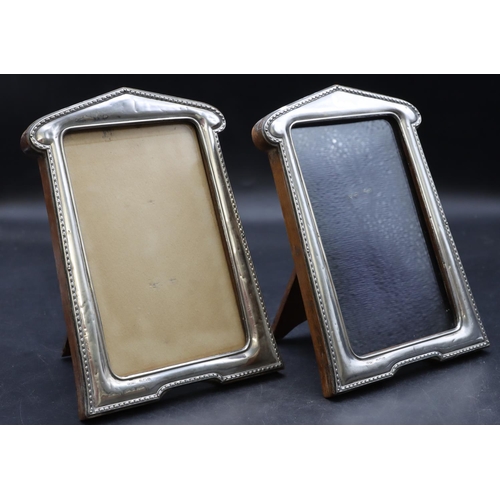 266 - A pair of Birmingham silver freestanding photograph frames with oak backs, 17.5cm high