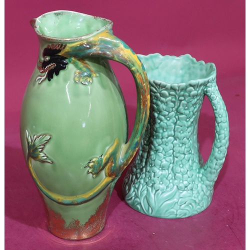 27 - Konny Kraft round bulbous jug with raised dragon handle on green ground, 31cm high and a Sylvac jug ... 