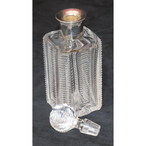 276 - A heavy square cut glass decanter with stopper, Sheffield silver neck and allover tooth cut decorati... 