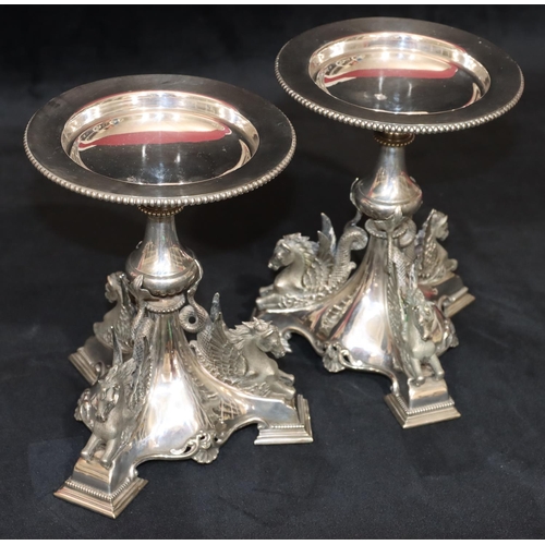 283 - A pair of 19th Century silver plated comport stands on turn stems with raised winged horses on tri-p... 