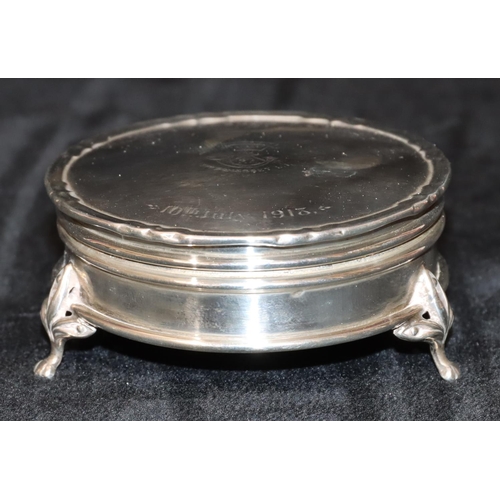 286 - A Birmingham silver round trinket box with engraved hinged lid depicting crest 