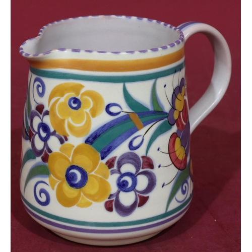 35 - A Poole jug on white ground with multi-coloured decoration, 13cm high, a Poole bulbous thin necked v... 