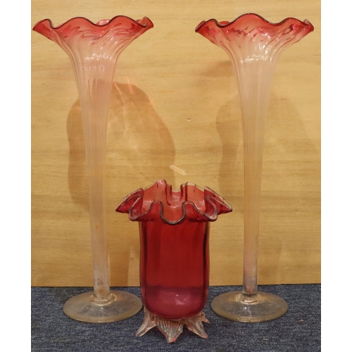 36 - A pair of clear glass and cranberry large round trumpet shaped vases with crinkled rims on round swe... 