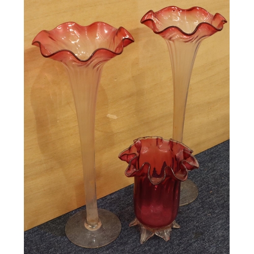 36 - A pair of clear glass and cranberry large round trumpet shaped vases with crinkled rims on round swe... 