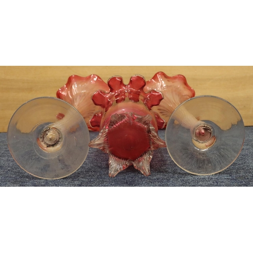 36 - A pair of clear glass and cranberry large round trumpet shaped vases with crinkled rims on round swe... 