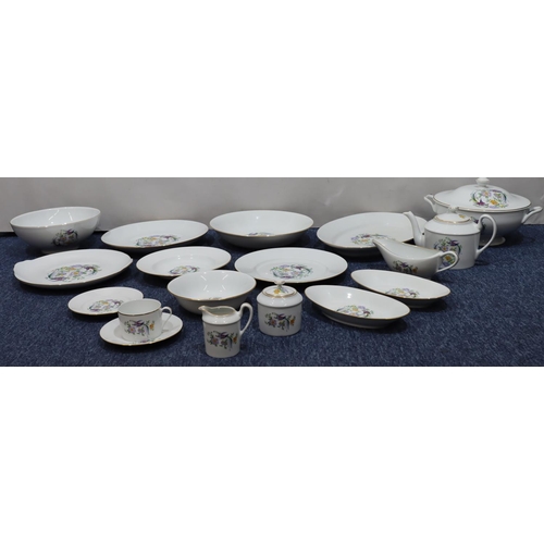 38 - A large Limoges dinner/tea service on white ground with multi-coloured bird, floral and leaf decorat... 