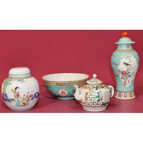 42 - An Oriental small round bulbous shaped teapot with cover and multi-coloured floral, leaf and scroll ... 