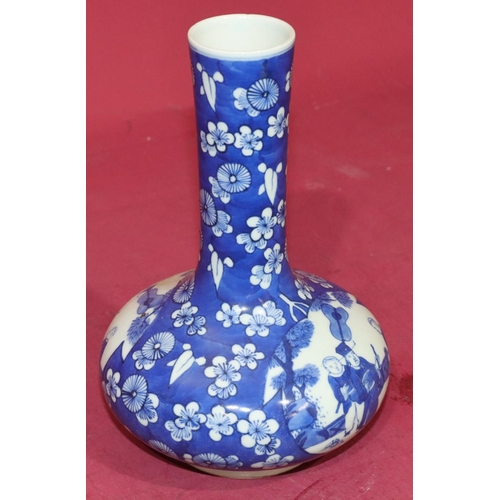 47 - An Oriental blue and white round bulbous thin necked vase with figure, floral and leaf decoration, 2... 