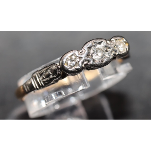 556 - An 18ct gold and platinum ladies' small 3-stone diamond ring, Size N, 2.2 grams gross