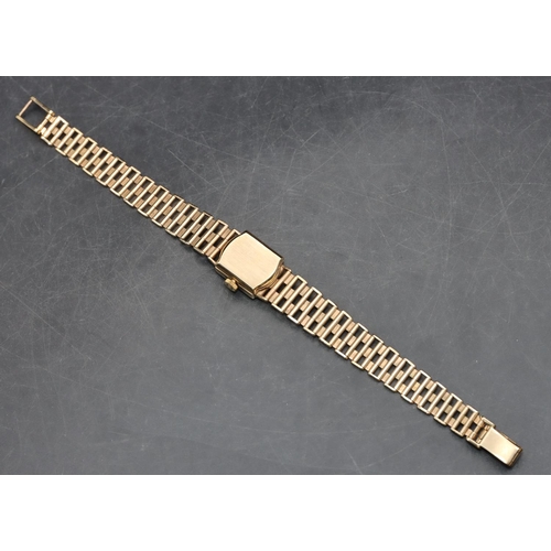 557 - A 9ct gold ladies' Omega square-faced wristwatch with matching strap bracelet, 19.8 grams without mo... 