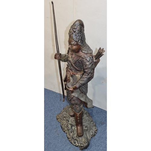 606 - A large bronze figure of a Samurai warrior holding a bow and  young chick on scallop shaped base (bo... 