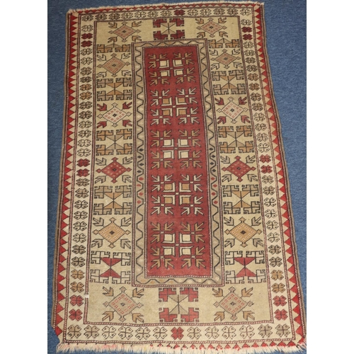 624 - A Persian rug on cream and red ground with centre medallion, 161cm x 94cm