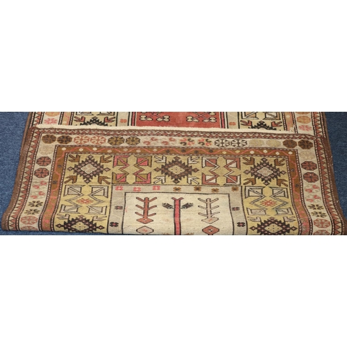 625 - A Persian rug on cream and red ground with shaped centre medallion, 189cm x 123cm