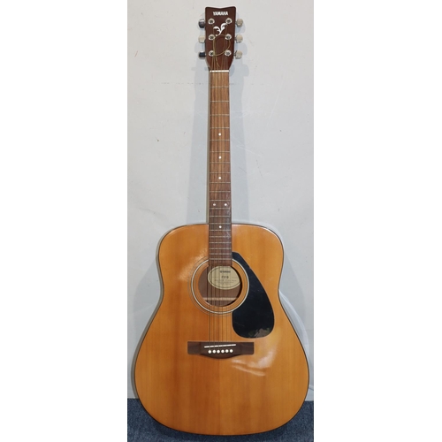 631 - A Yamaha F310 6-string guitar, 103cm high overall