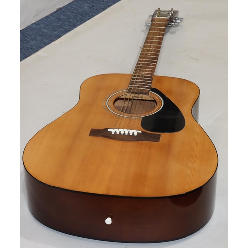 631 - A Yamaha F310 6-string guitar, 103cm high overall