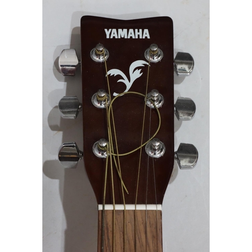 631 - A Yamaha F310 6-string guitar, 103cm high overall