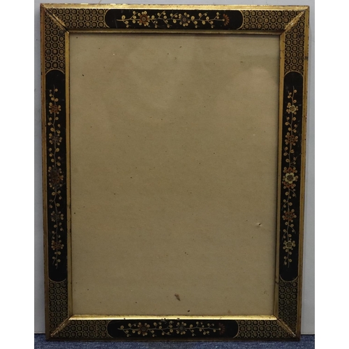 633 - An oriental black and gilt lacquered frame with allover floral and leaf decoration, overall size 43.... 