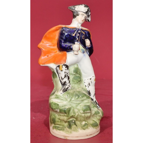 66 - A 19th Century Staffordshire figure of a naval gentleman, 22cm high (black paint flaking)