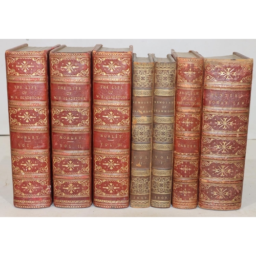 668 - A set of 3 red leather bound books 