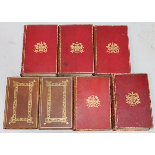 668 - A set of 3 red leather bound books 