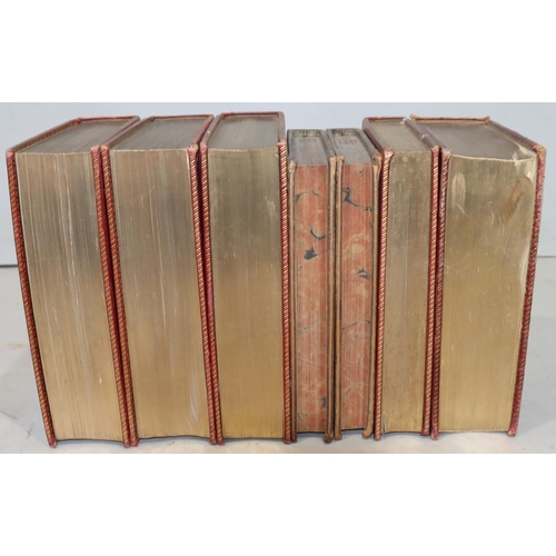 668 - A set of 3 red leather bound books 