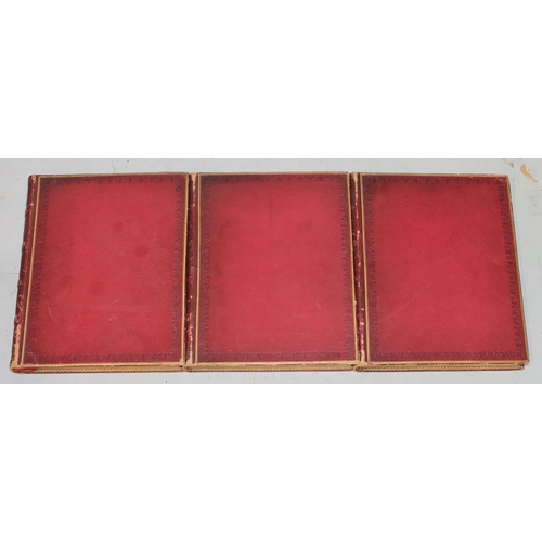 672 - A set of 3 red leather bound 