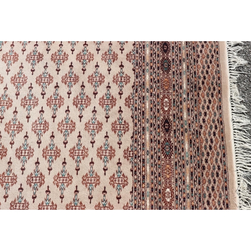 687 - A modern Persian carpet on cream ground with allover medallions, 288cm x 230cm