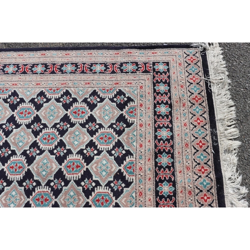 688 - A 20th Century Persian rug on cream and blue ground with allover medallions, 229cm x 156cm