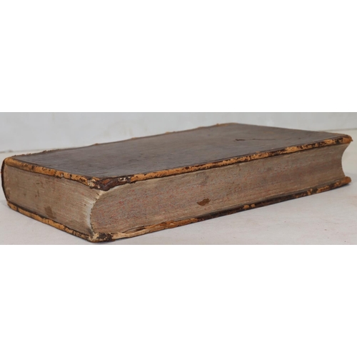 697 - An 18th Century leather bound book, 