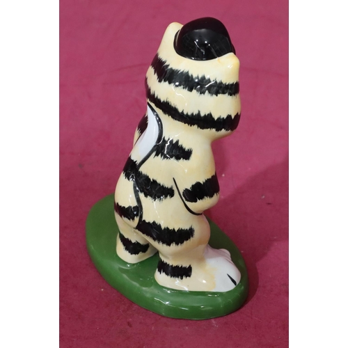 7 - A Lorna Bailey Art Deco style china figure of a cat playing golf, 14cm high