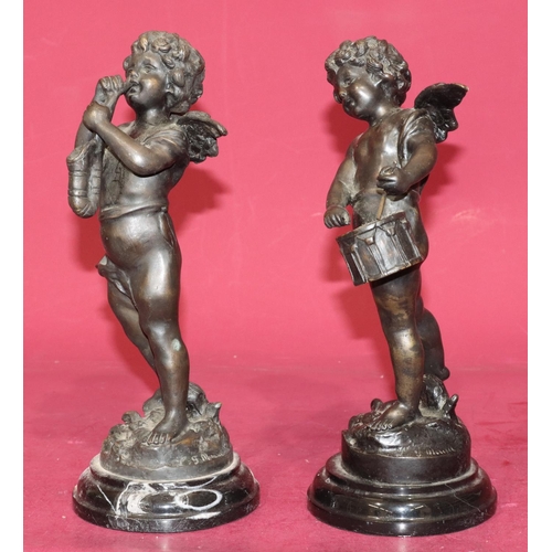 711 - A pair of reproduction bronze figures of cupids playing musical instruments on black sweeping bases,... 