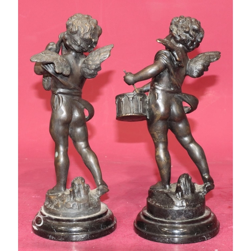 711 - A pair of reproduction bronze figures of cupids playing musical instruments on black sweeping bases,... 