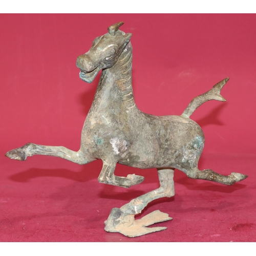 716 - A Continental bronze figure of a running horse, 24.5cm high