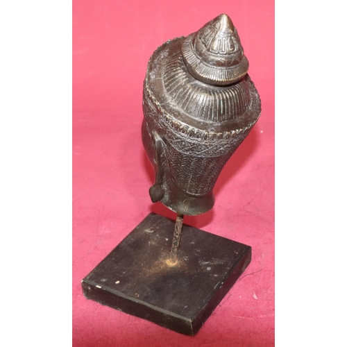 719 - An Eastern bronze figurehead of a lady on later stand and wooden base, 30cm high overall