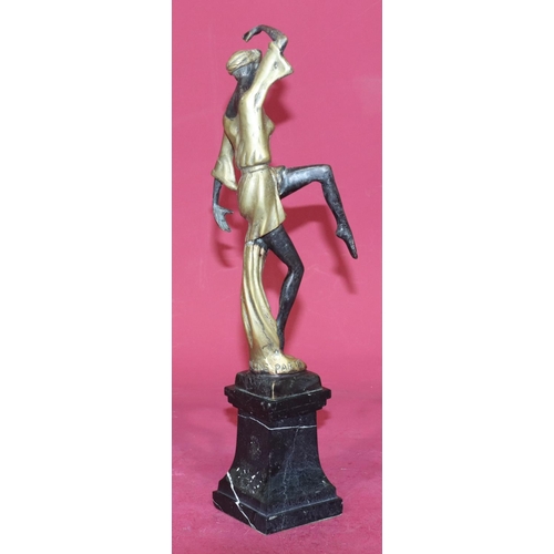 723 - A reproduction Art Deco style gilt bronze figure of a female dancer on square black onyx plinth, 38.... 