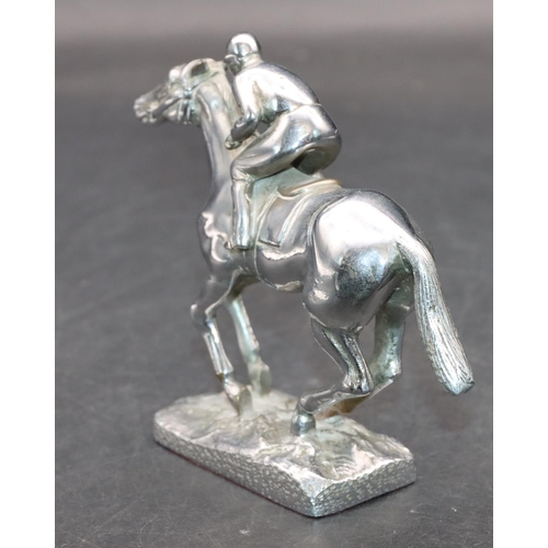 733 - A chrome car mascot in the form of a jockey on horseback, 11cm high, 13.5cm long