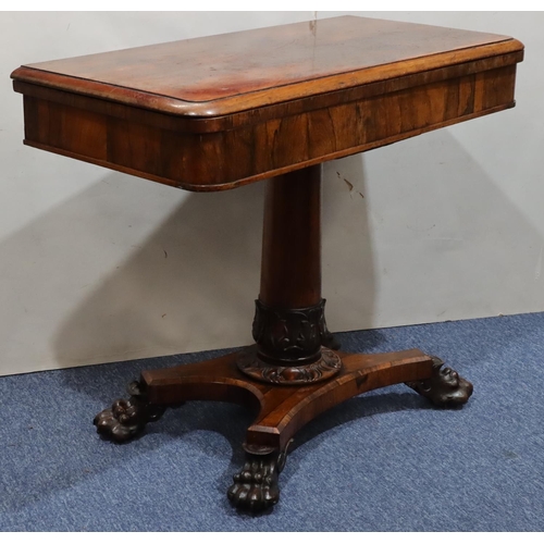 756 - A 19th Century rosewood card table with hinged swivel top and circular green baize interior, on gun ... 