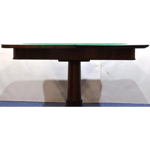 756 - A 19th Century rosewood card table with hinged swivel top and circular green baize interior, on gun ... 