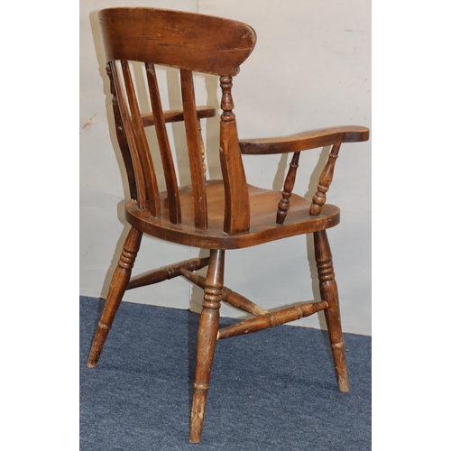 758 - An elm stick back armchair with solid seat on round turned legs