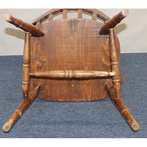 758 - An elm stick back armchair with solid seat on round turned legs