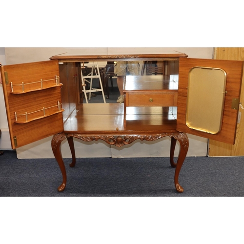 759 - A reproduction burr walnut cocktail cabinet with glass top, 2 panel doors on cabriole legs, 95cm wid... 